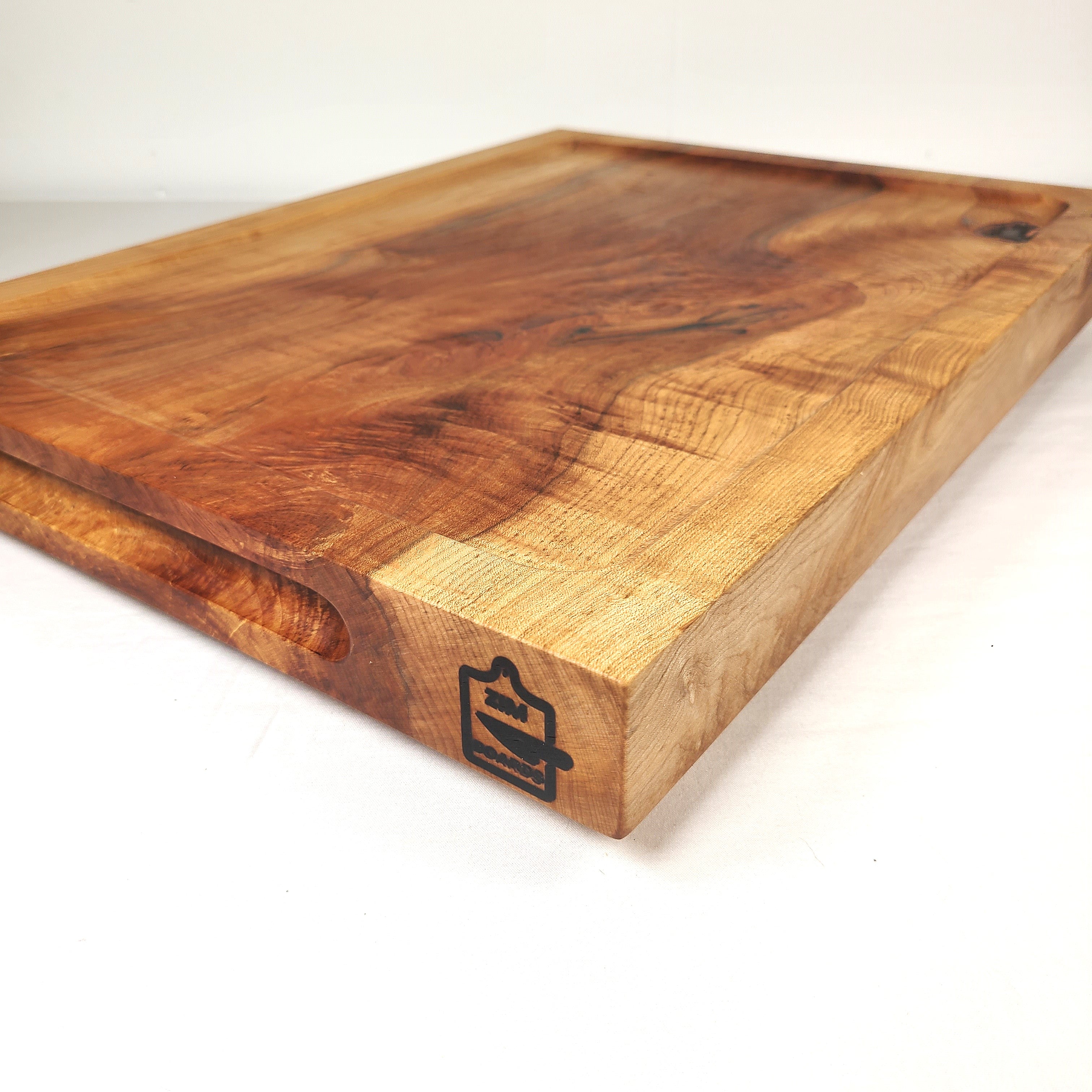 side view of a 2 inch thick maple cutting, carving or charcuterie board.  Made in USA using local and ethically sourced wood by ZimBoards